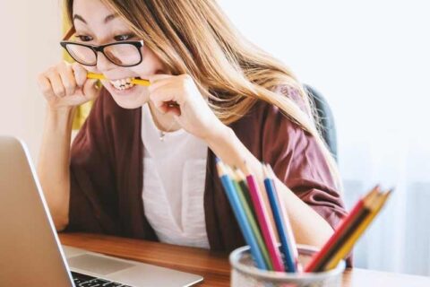 Girl is sitting in front of laptop